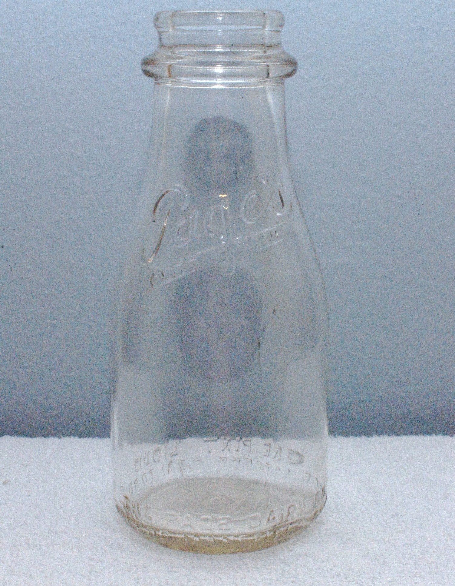 Embossed Pages Pint Milk Bottle Early 1940s